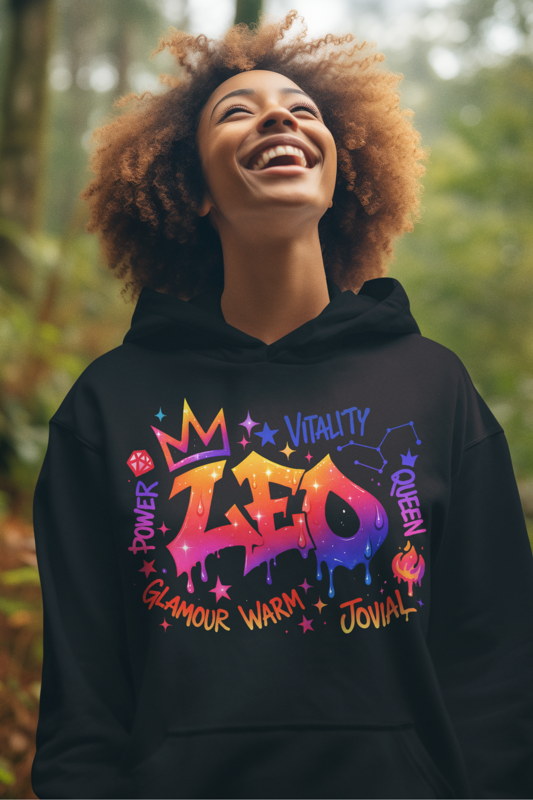 Person wearing a black hoodie with colorful text in a forest